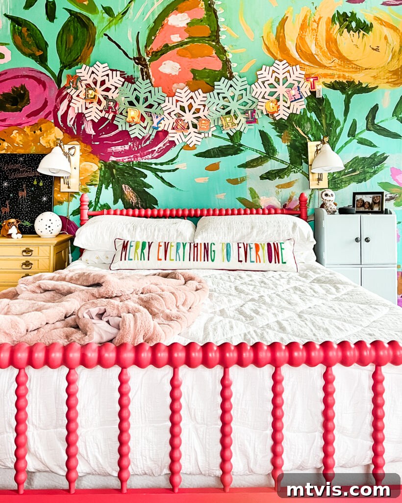 Attley's vibrant bedroom decorated for Christmas with a lighted garland and colorful accents.