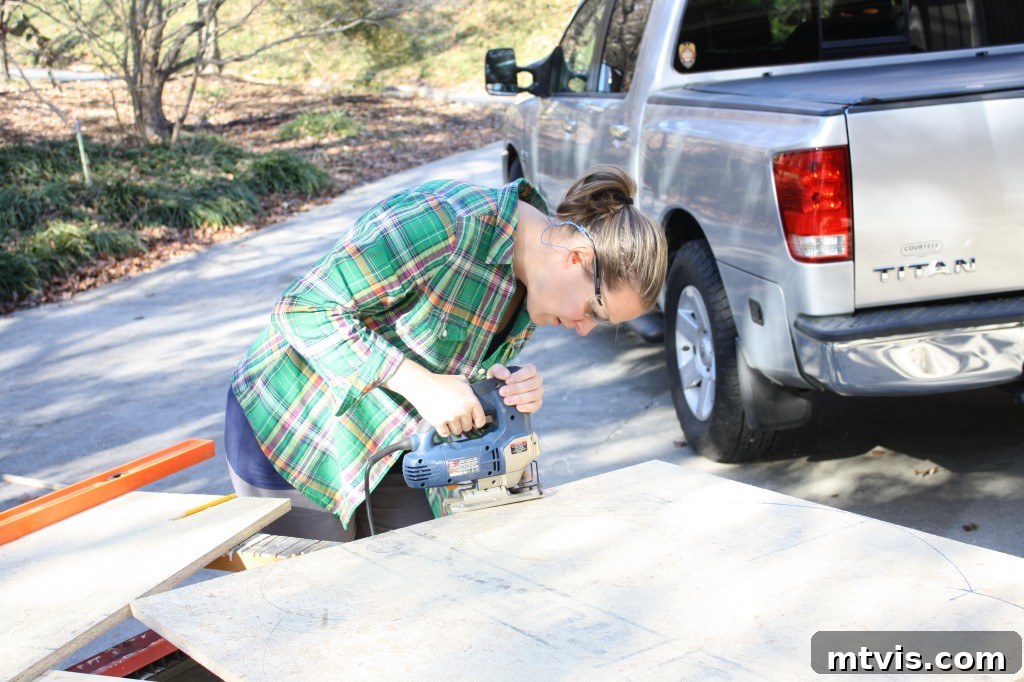 Build Your Upholstered Headboard in an Afternoon 6 Cutting the marked curved shape of the headboard using a jigsaw, creating the custom base.