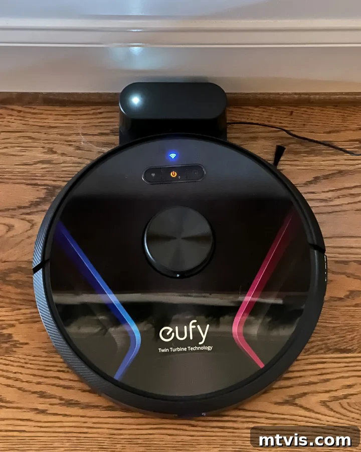 Eufy robot vacuum cleaner efficiently cleaning floors, highlighting its role in keeping a house clean with dogs.