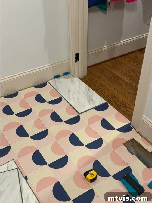 Install a Floating Tile Floor Like a Pro 3 Installing the first floating tile, showing spacers along the wall