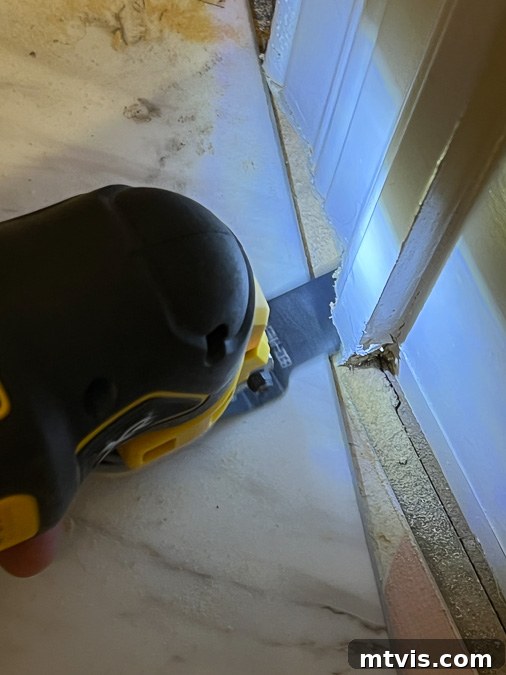 Install a Floating Tile Floor Like a Pro 4 Using an oscillating tool to undercut a door casing