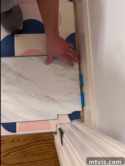 Install a Floating Tile Floor Like a Pro 5 Floating tile cut to fit around a door threshold