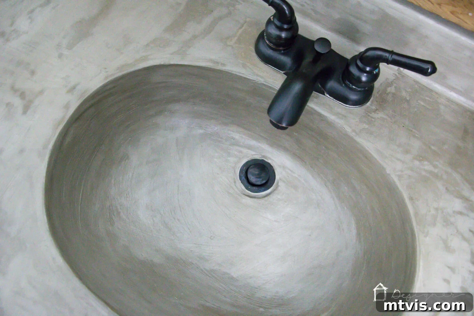 Effortless DIY Concrete Vanity and Sink No Forms No Heavy Lifting 13 Close-up of the DIY concrete sink basin, highlighting its smooth, contemporary finish and integrated design.