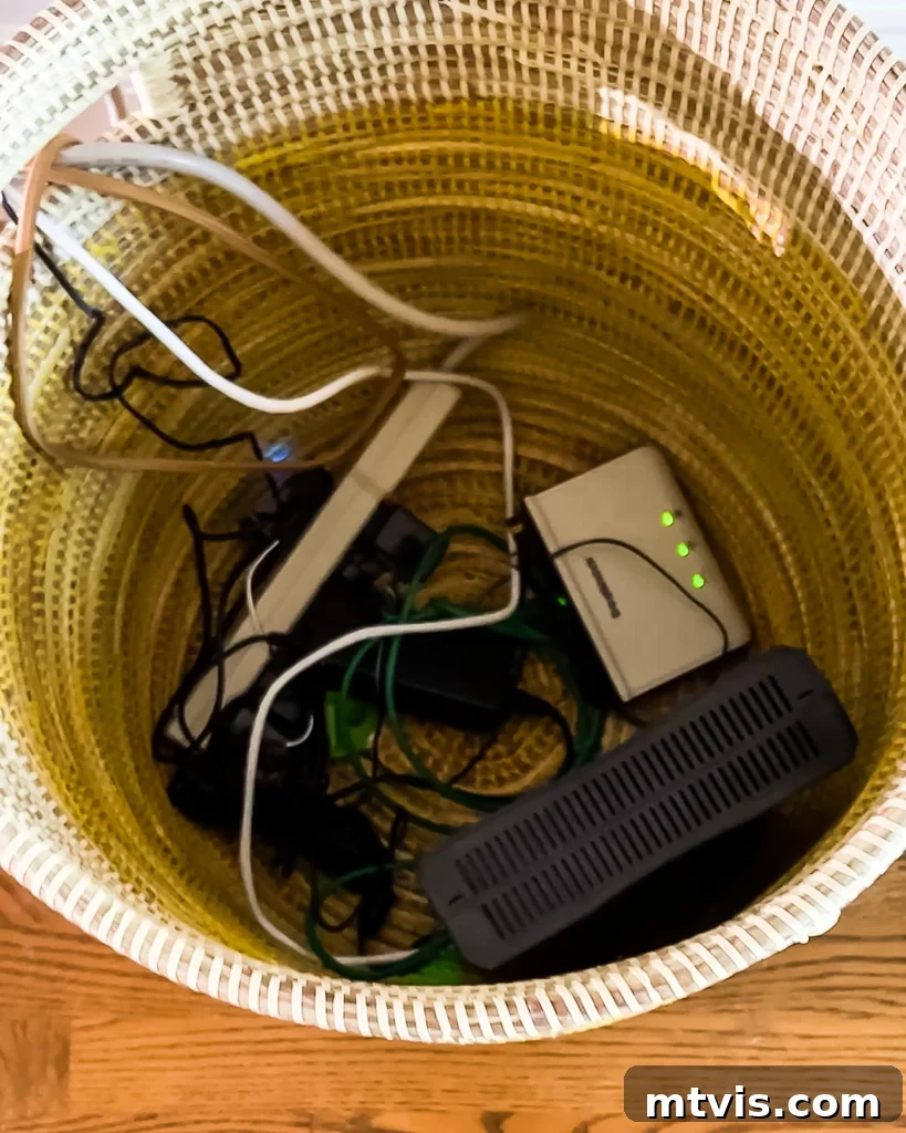 Your Realistic Roadmap to a Decluttered Home 13 Ugly cords hidden in a pretty woven basket behind a sofa