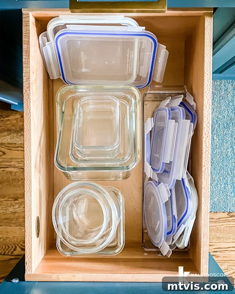 Your Realistic Roadmap to a Decluttered Home 8 Decluttered kitchen drawer with various food storage containers stacked neatly