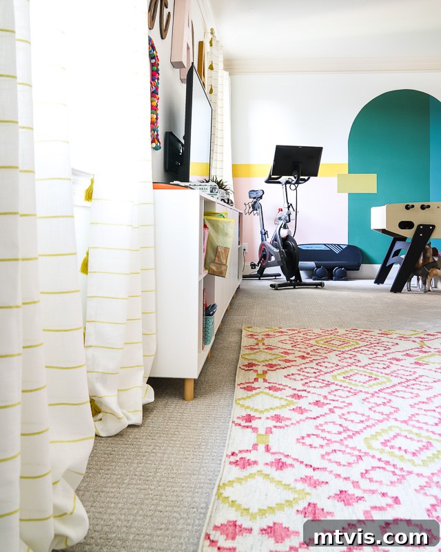 Our Family's Colorful Oasis: A Bonus Room Tour 7 Stylish and casual curtains hanging in the colorful family bonus room, adding a fun touch