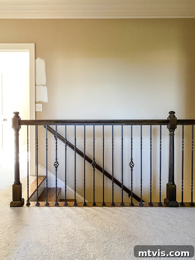 Stair Railing Makeover Replace Balusters for a Fresh Look 5 old stair railing in upstairs hallway