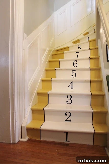 Elevate Your Entryway: Creative Stair Runner Designs 6 A vibrant yellow painted staircase featuring ascending numbers, a unique and fun DIY stair runner idea to update home decor.