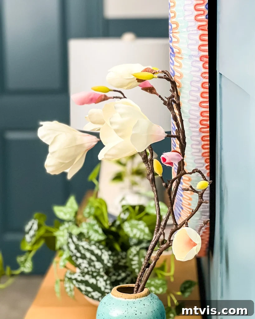 Effortless Board and Batten Accent Wall DIY 18 Decorated board and batten wall with a DIY napkin mirror and floral accent