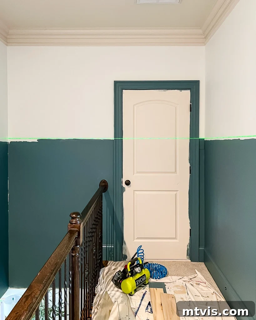 Effortless Board and Batten Accent Wall DIY 3 Marking the top height for board and batten on a hallway wall