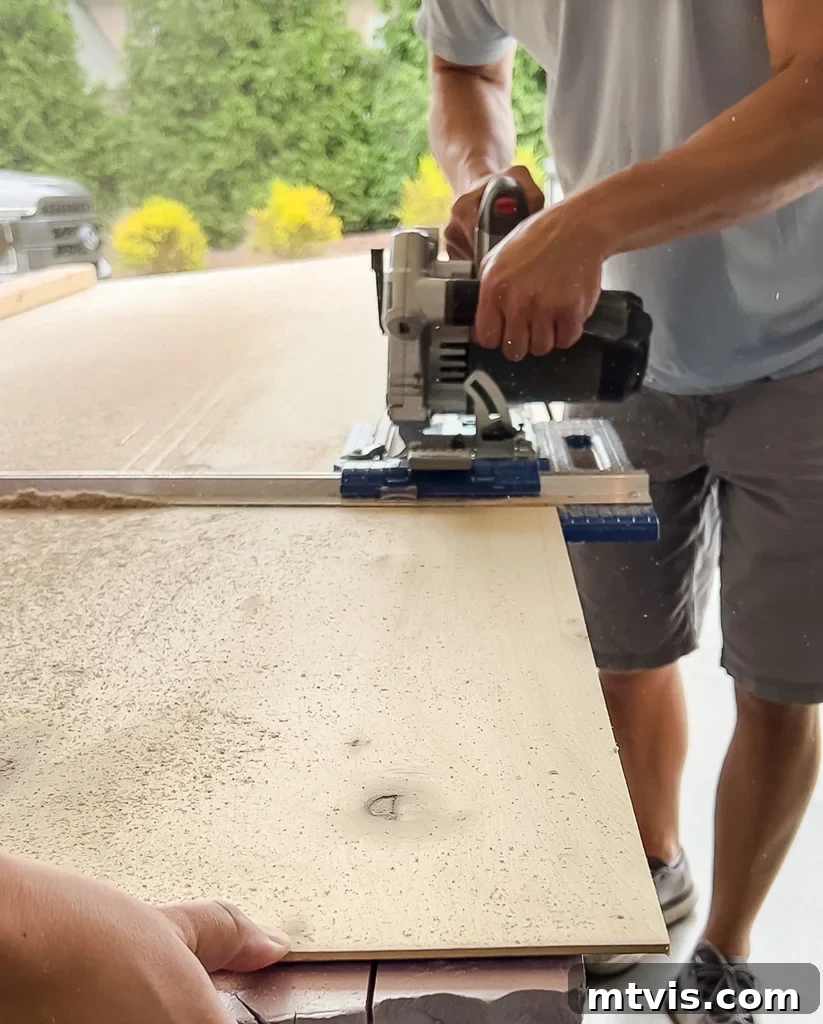 Effortless Board and Batten Accent Wall DIY 5 Using a circular saw with a guide to rip plywood for battens