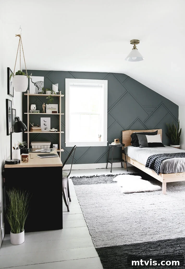A bedroom with a unique ceiling shape is highlighted with a dark grey board and batten accent wall. 