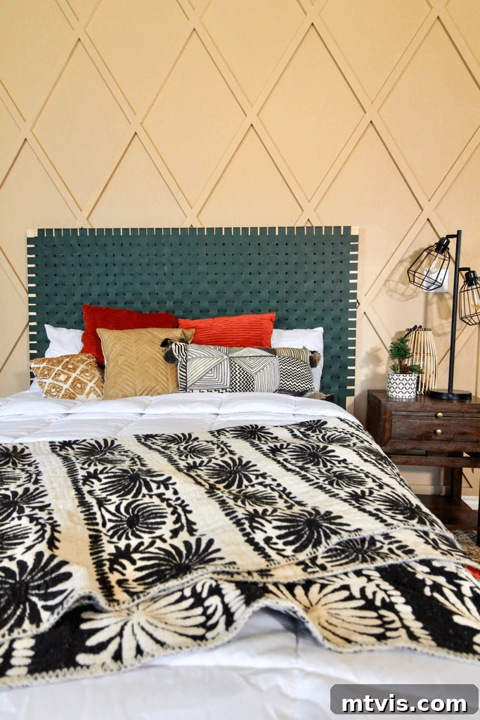 A diamond board and batten pattern makes a butterscotch wall pop behind a green headboard and funky multicolored pillows. 