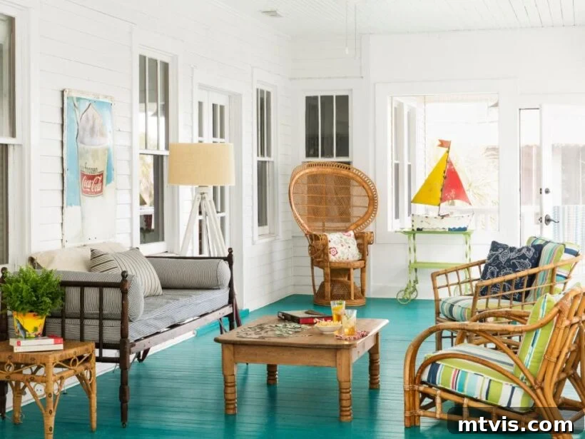 Unlock Your Porch's Potential: Designer Decor Secrets 12 teal painted porch floor with vibrant decor and natural wood furniture