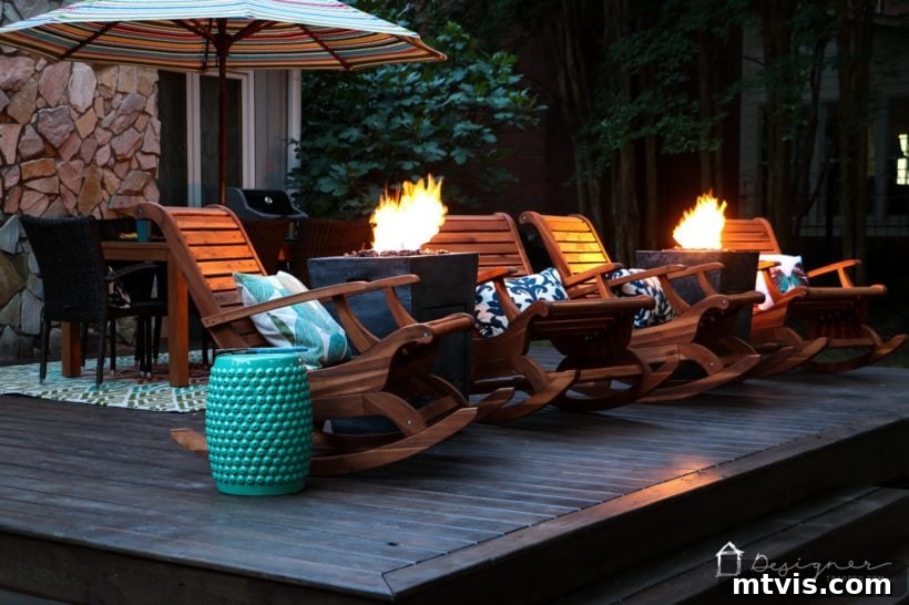 Unlock Your Porch's Potential: Designer Decor Secrets 3 teak chairs and fire columns creating a warm glow on a back porch at dusk