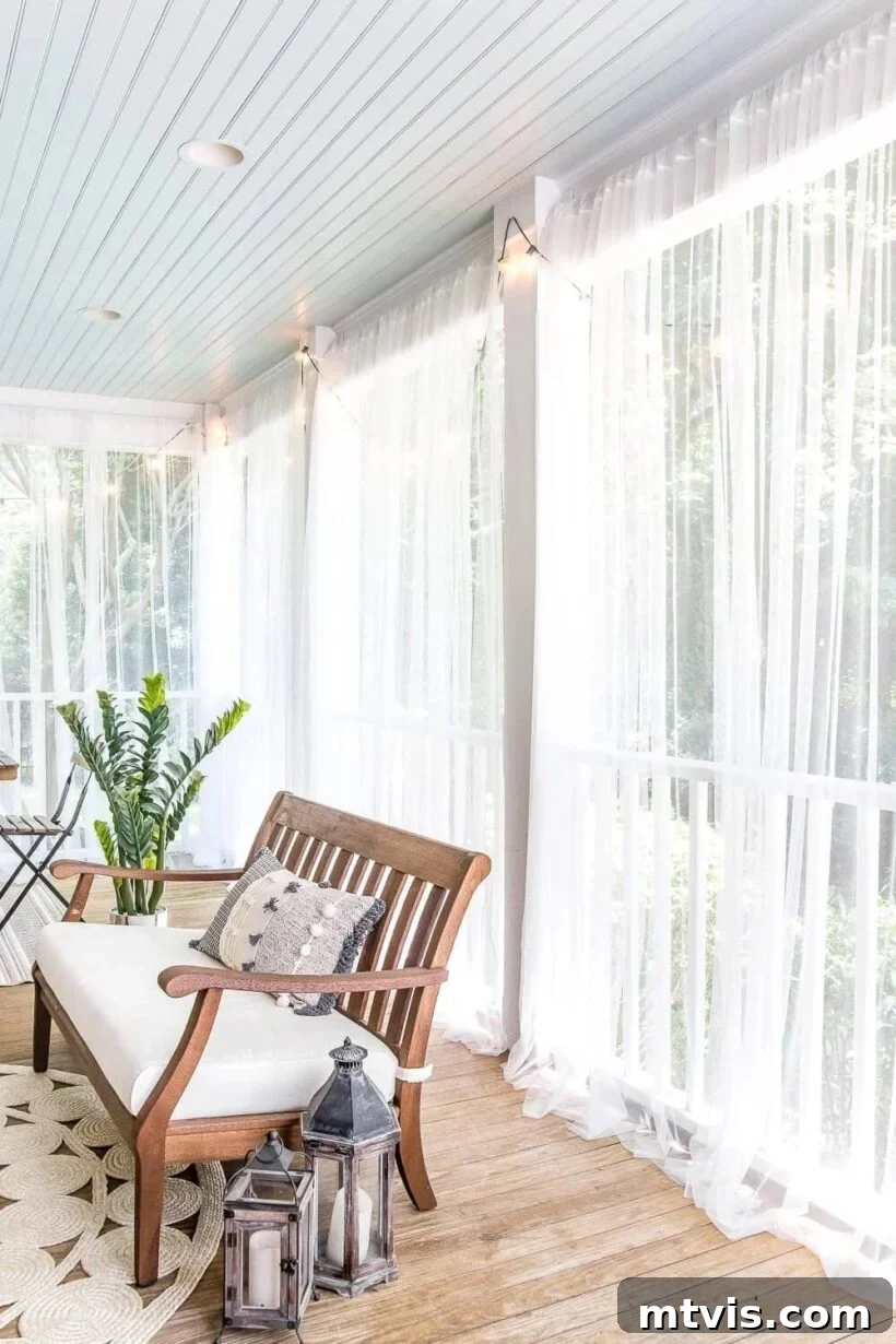 Unlock Your Porch's Potential: Designer Decor Secrets 8 porch with sheer privacy curtains gracefully framing the space