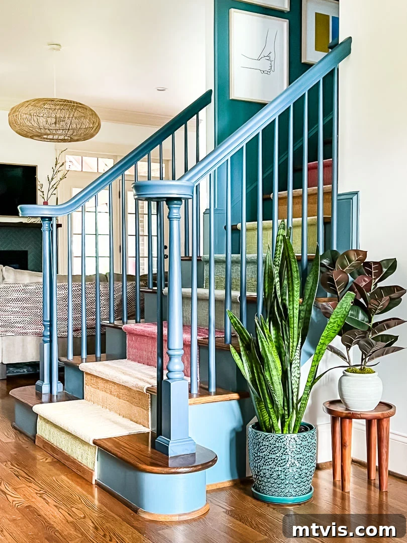 Ultimate Guide to Stair Runner Installation 17 Installing a stained oak strip at the bottom of the stair runner for a finished look.