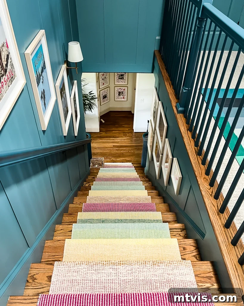 Ultimate Guide to Stair Runner Installation 22 Blue staircase with colorful artwork and a newly installed stair runner, showcasing the updated aesthetic.