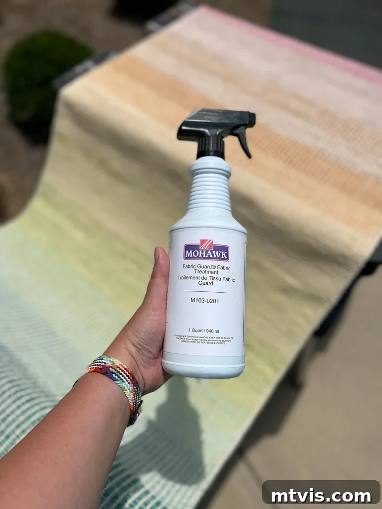 Ultimate Guide to Stair Runner Installation 9 Applying fabric guard spray to a stair runner before installation to protect it from stains.
