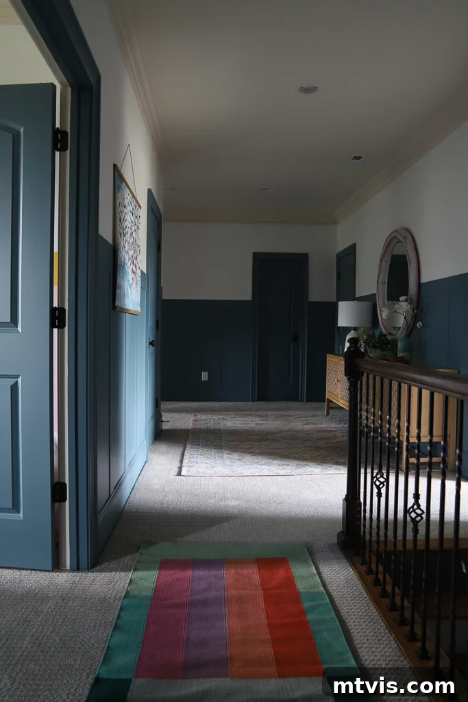 Sun Tunnels A Smart Addition To Your Home 3 Dark, unlit upstairs hallway before sun tunnel installation, showing reliance on artificial light even with doors open.