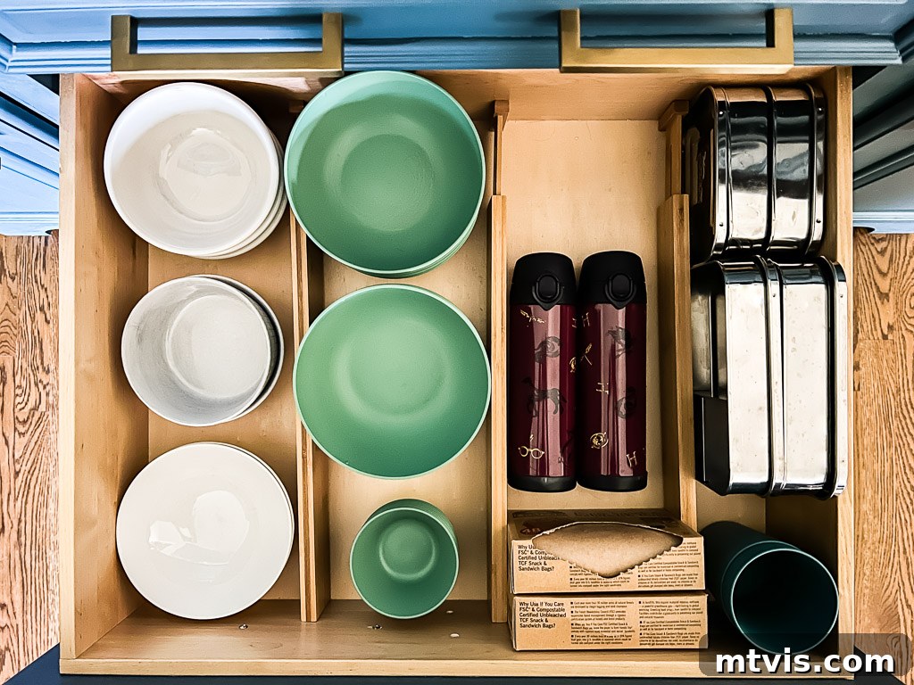 Everyday Kitchen Cabinet Organization 10 An overhead view of how to organize kitchen cabinets and drawers using bamboo drawer dividers and a drawer for plates and bowls.