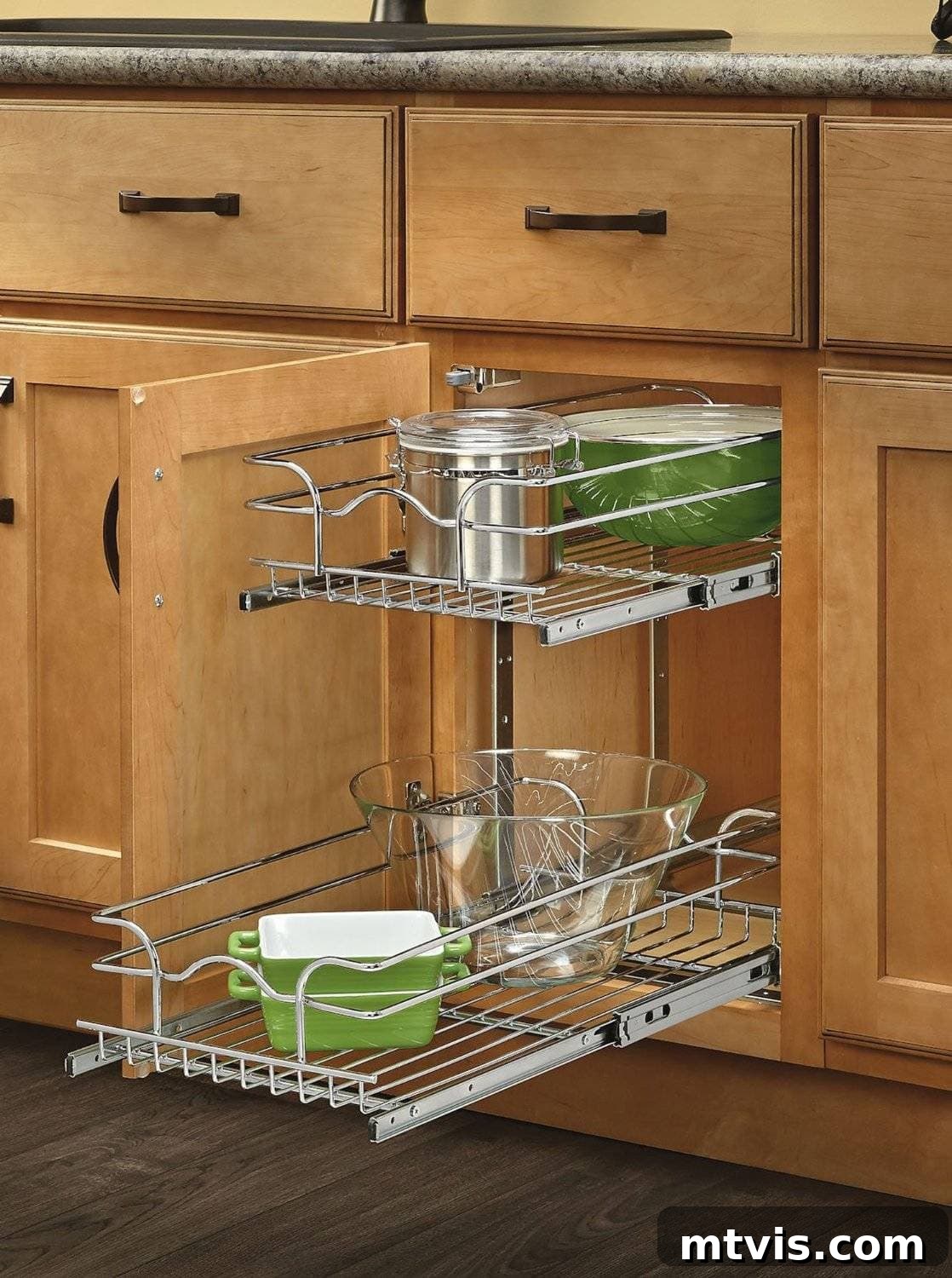 Everyday Kitchen Cabinet Organization 18 A cookie sheet and cutting board organizer holding various cutting boards and muffin tins against a white background.