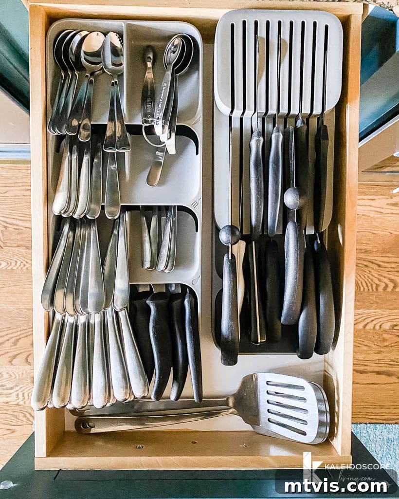 Everyday Kitchen Cabinet Organization 7 An overhead view of space saving utensil storage and a knife block that all fit in one drawer which is a great way to organize your kitchen drawers and cabinets.