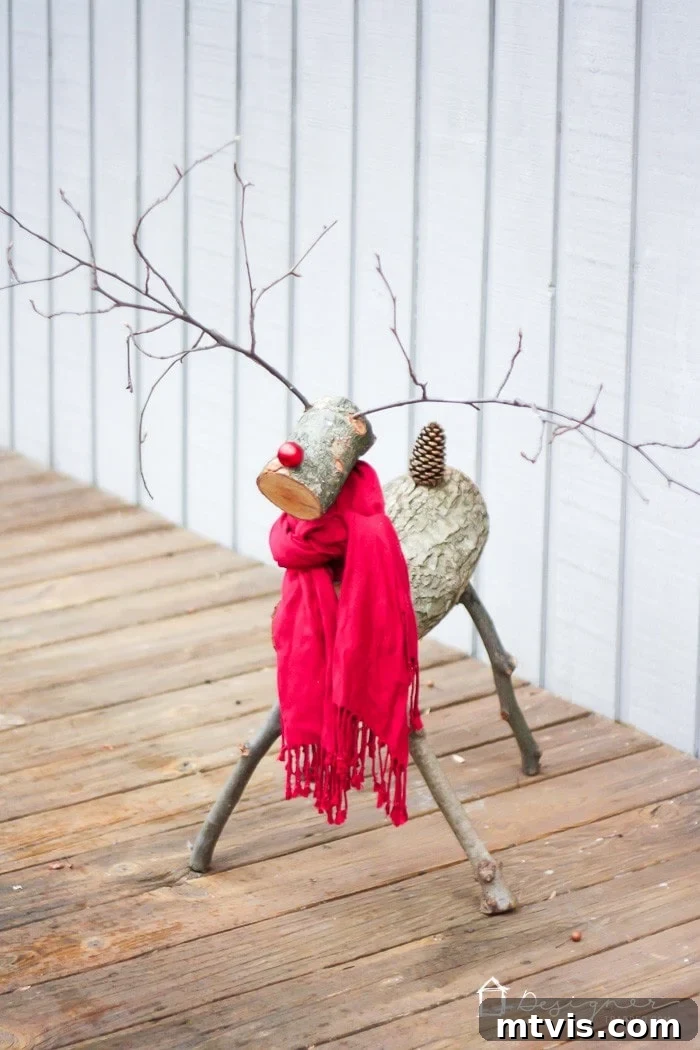 Crafting a Rustic Christmas Reindeer from Logs 11 Finished outdoor Christmas reindeer made from logs and branches