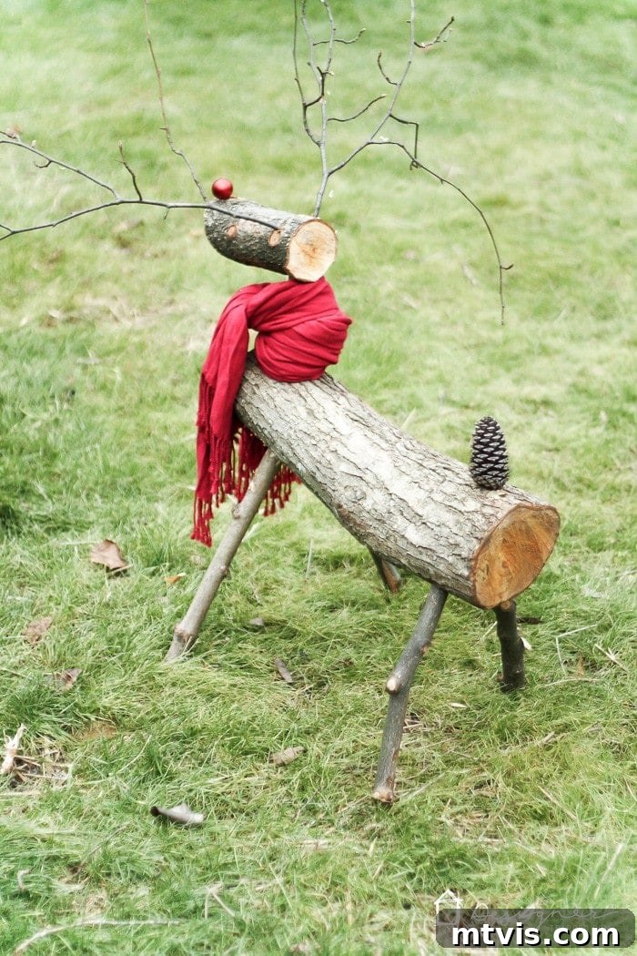 Crafting a Rustic Christmas Reindeer from Logs 12 Log reindeer with a red scarf as a natural Christmas decoration