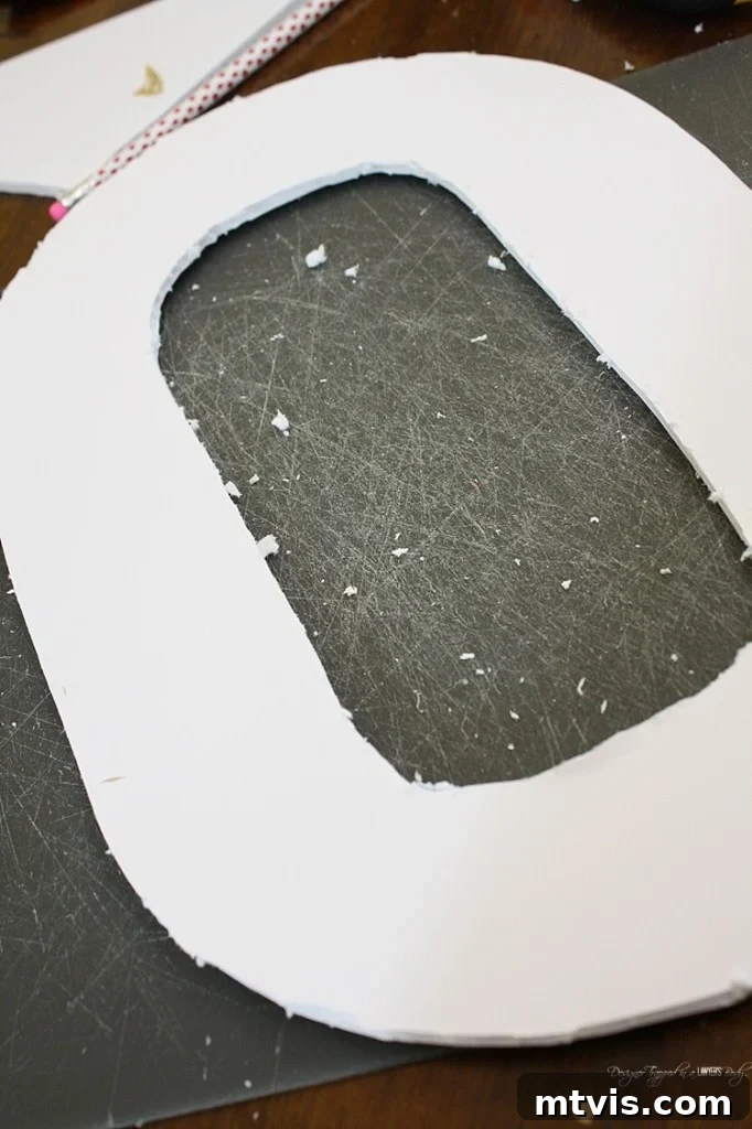 Valentines Door Decor DIY 5 The 'X' and 'O' shapes cleanly cut out from foam core board, ready for the next step.