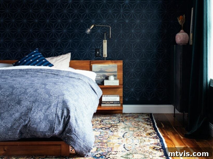 Dramatic dark navy stenciled bedroom walls in Benjamin Moore Polo Blue, creating a peaceful sanctuary.