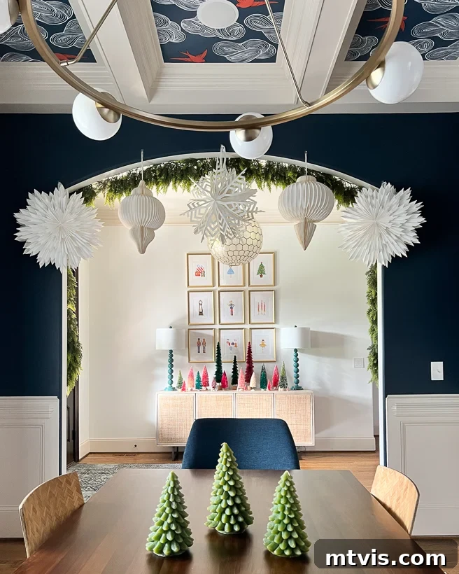 Design Your Dream Christmas Aesthetic 11 Christmas aesthetic - Photo of dining room and entryway with colorful accents and bottlebrush trees decorated for Christmas by Tasha Agruso of Kaleidoscope Living