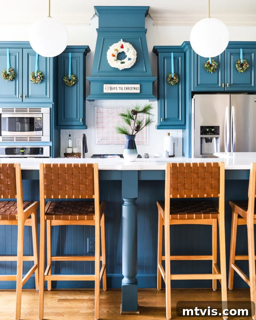Design Your Dream Christmas Aesthetic 12 Christmas aesthetic - Photo of kitchen with mini wreaths on cabinets by Tasha Agruso of Kaleidoscope Living