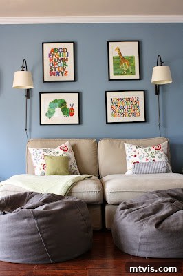 Comfortable and Engaging Playroom Playroom with chaise lounges and a chalkboard wall