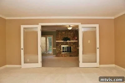 The Ultimate Playroom Unveiled 6 Dated carpet and dim lighting in the former living room