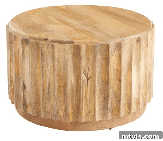 World Market Ishan driftwood coffee table with beautiful carved sides and rich wood grain, offering an organic feel