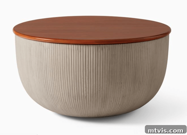 West Elm Odin storage coffee table featuring a concrete base and warm walnut top, perfect for modern interiors