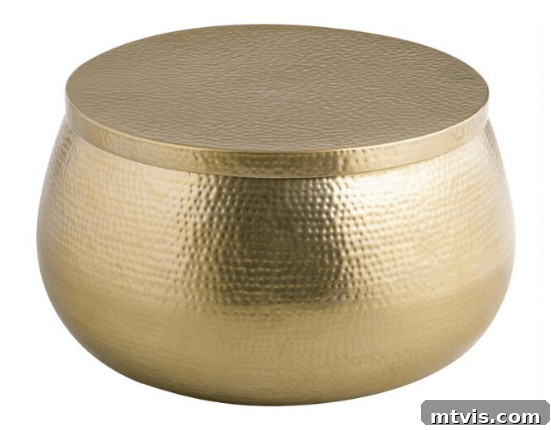 World Market Cala hammered storage coffee table in gold, offering a glamorous and versatile storage solution
