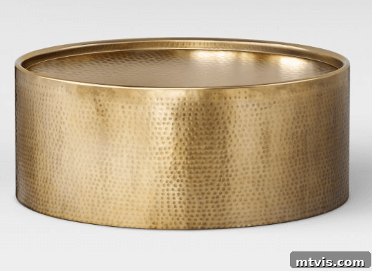 Target hammered drum coffee table in gold, an elegant and sculptural piece for modern living rooms