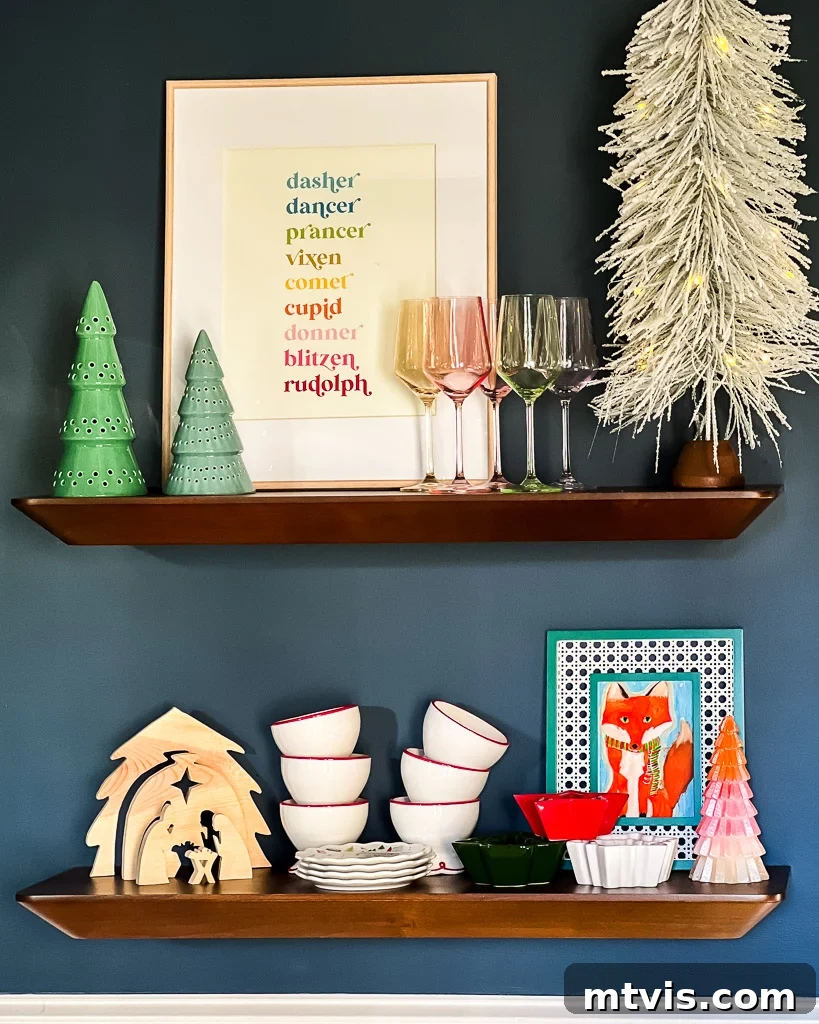 Dining room adorned for Christmas with seasonal artwork and holiday dishes, showcasing a festive garland draped over art.