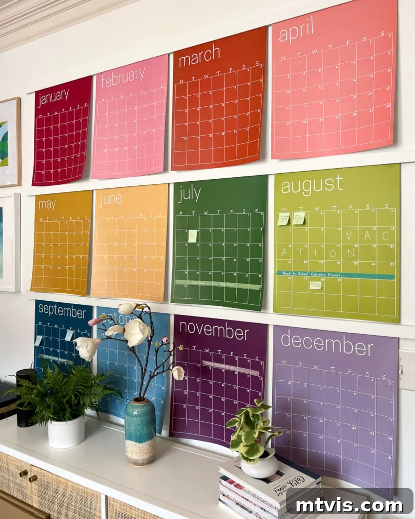Conquer Family Chaos: Calendar Strategies for a Peaceful Home 7 A sophisticated large monthly wall calendar from Kaleidoscope Living, featuring soft rainbow hues, providing a chic and functional organizational solution for a busy family.
