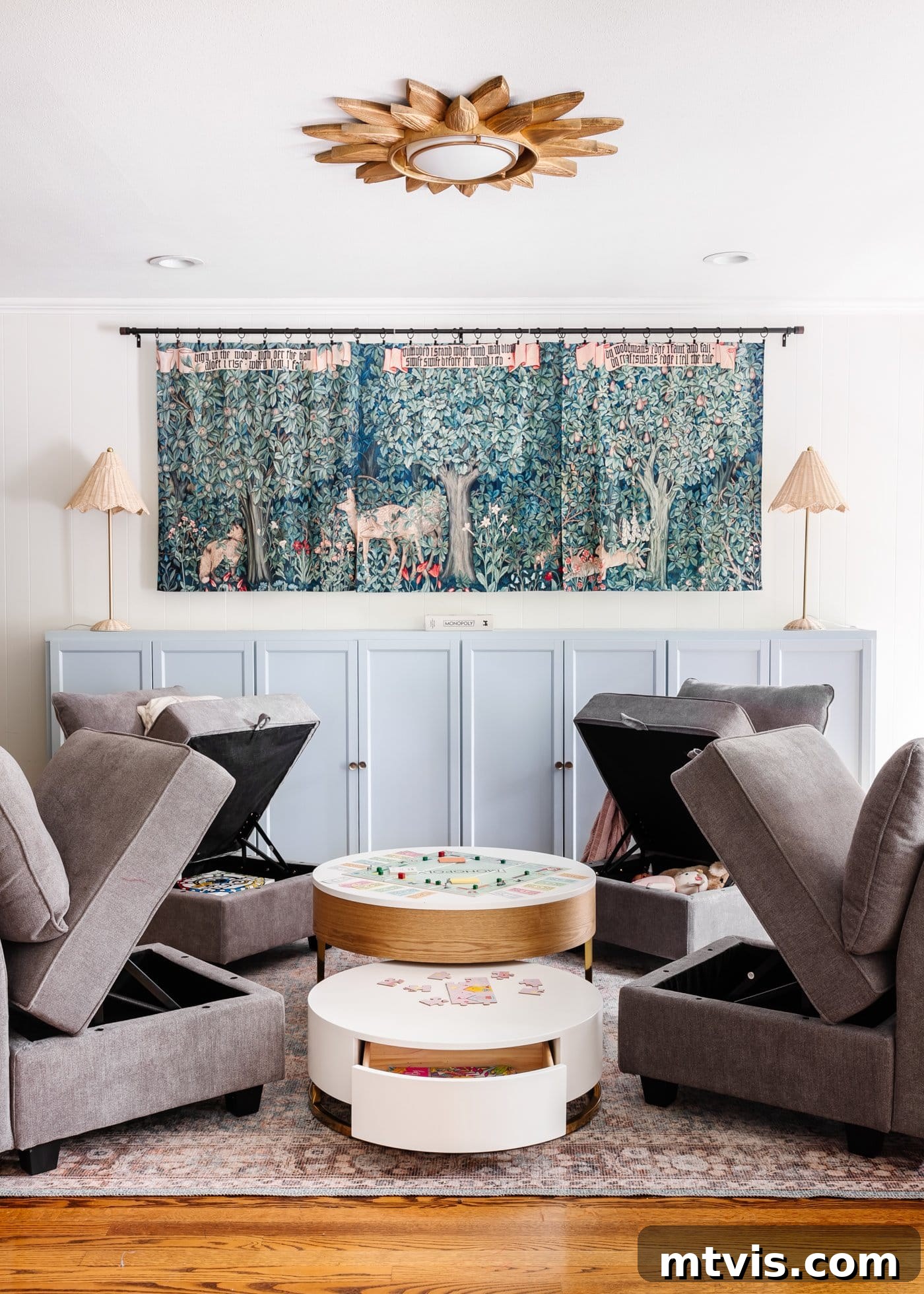 Playful and Chic Playroom Design Guide 12 Four storage chairs with the seats lifted surround a multi-level round coffee table in a playroom.