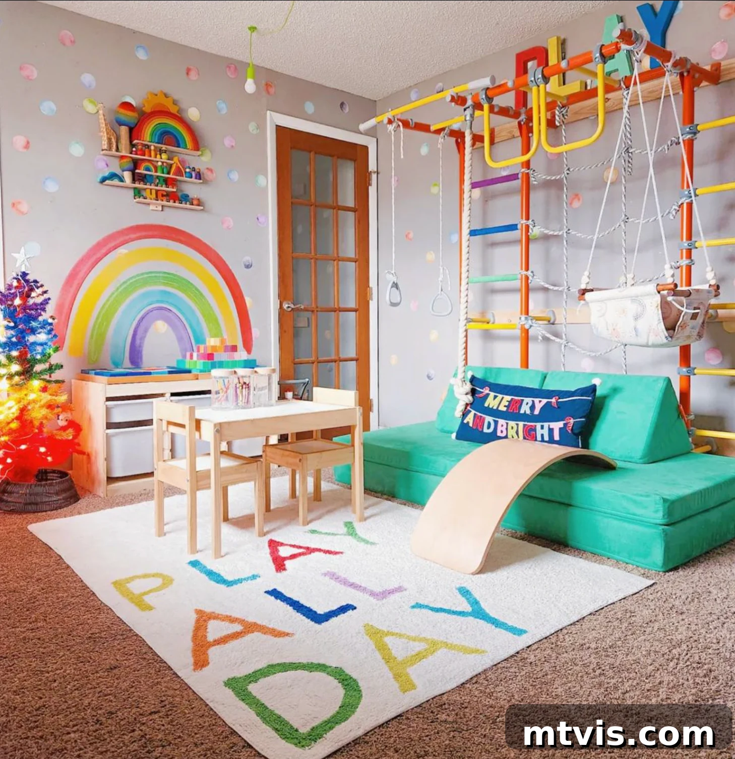 Playful and Chic Playroom Design Guide 3 A colorful indoor gym and playroom for young children includes a play table, storage bins, and a green couch. The rug says "Play all day."