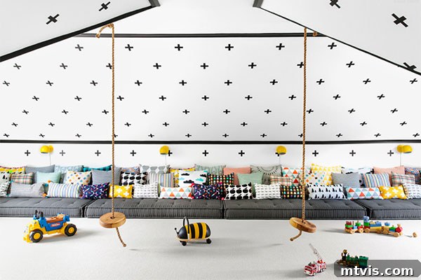Playful and Chic Playroom Design Guide 21 Playroom ideas for attics with angled ceilings include black crosses along the wall and ceiling, cushions on the floor for seating, and two hanging rope swings.