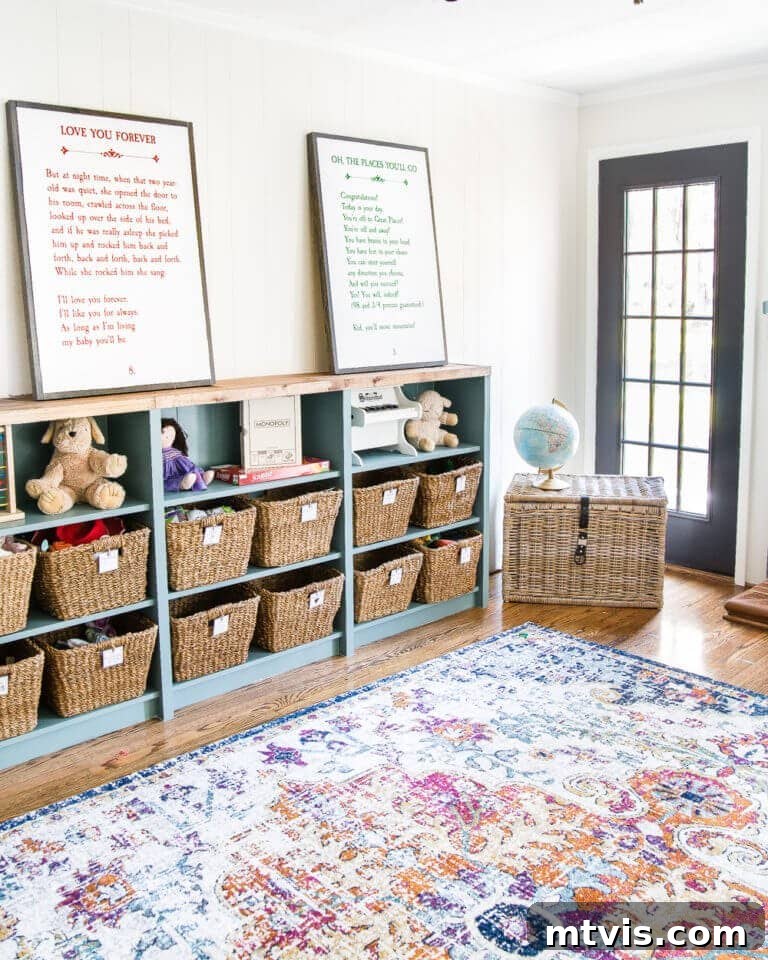 Playful and Chic Playroom Design Guide 6 A bright playroom wall with an IKEA bookshelf hack that turns bookcases into horizontal storage. You can find playroom ideas and more in this blog.