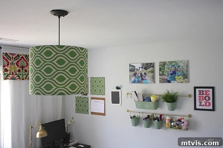Finished custom fabric pendant light hanging elegantly in a modern craft room