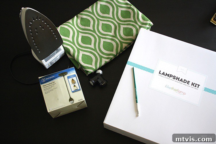 All materials laid out for crafting a DIY fabric pendant light