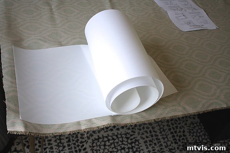 Applying adhesive styrene backing to custom fabric for drum lampshade