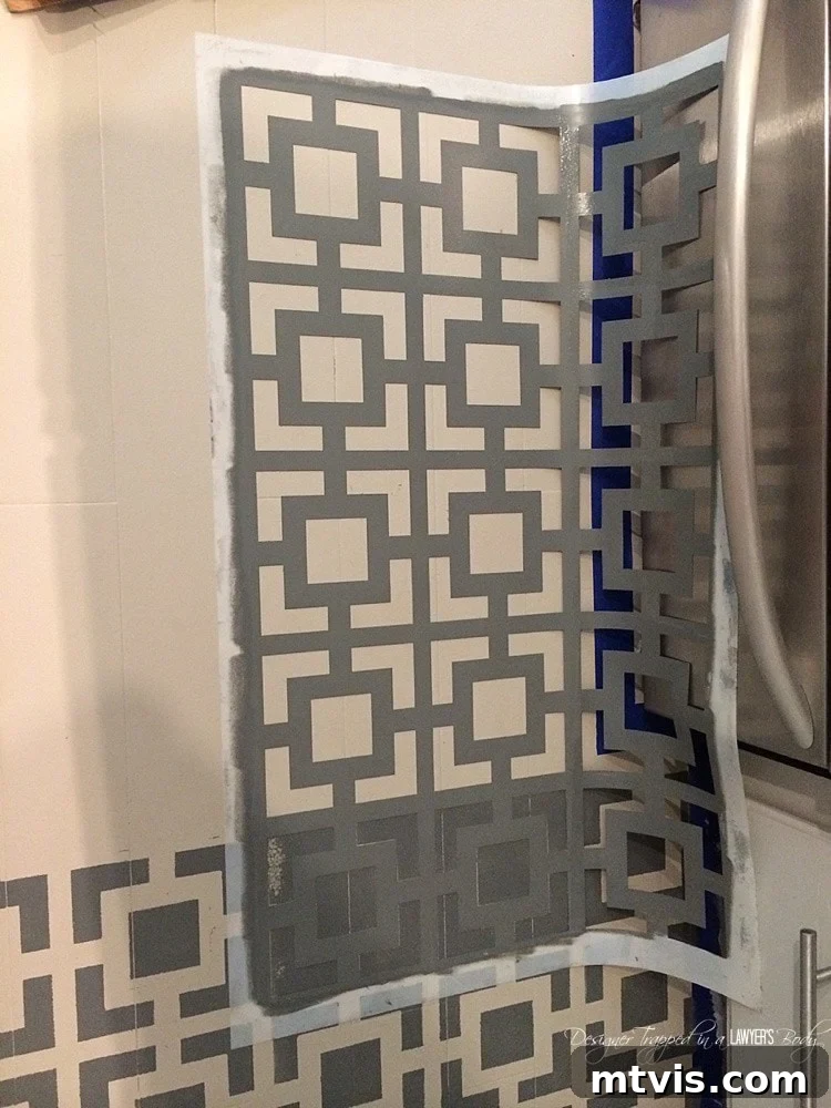Successfully stenciling around perimeter edges and obstacles like cabinets requires careful placement and patience. This technique ensures a seamless, professional finish for your DIY painted and stenciled floors.