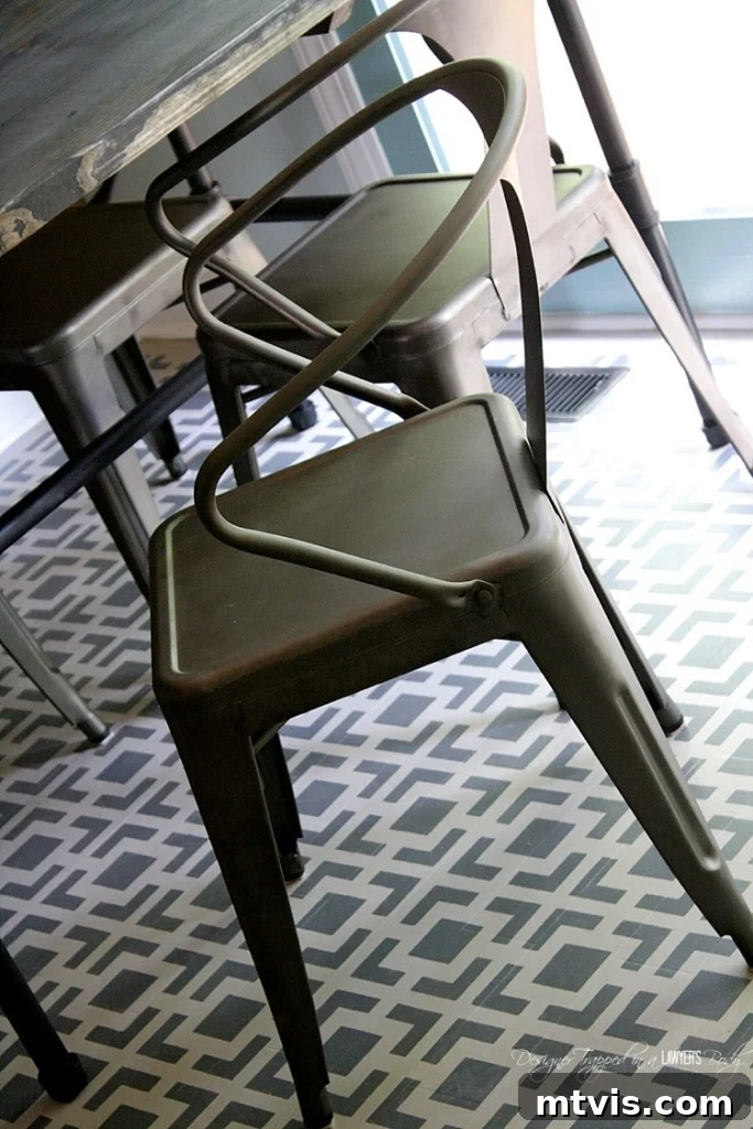 A wide shot showcasing the completed stenciled floor project, integrated seamlessly into the room's decor. This budget-friendly DIY offers a high-impact solution for refreshing damaged wood floors with a personal touch.